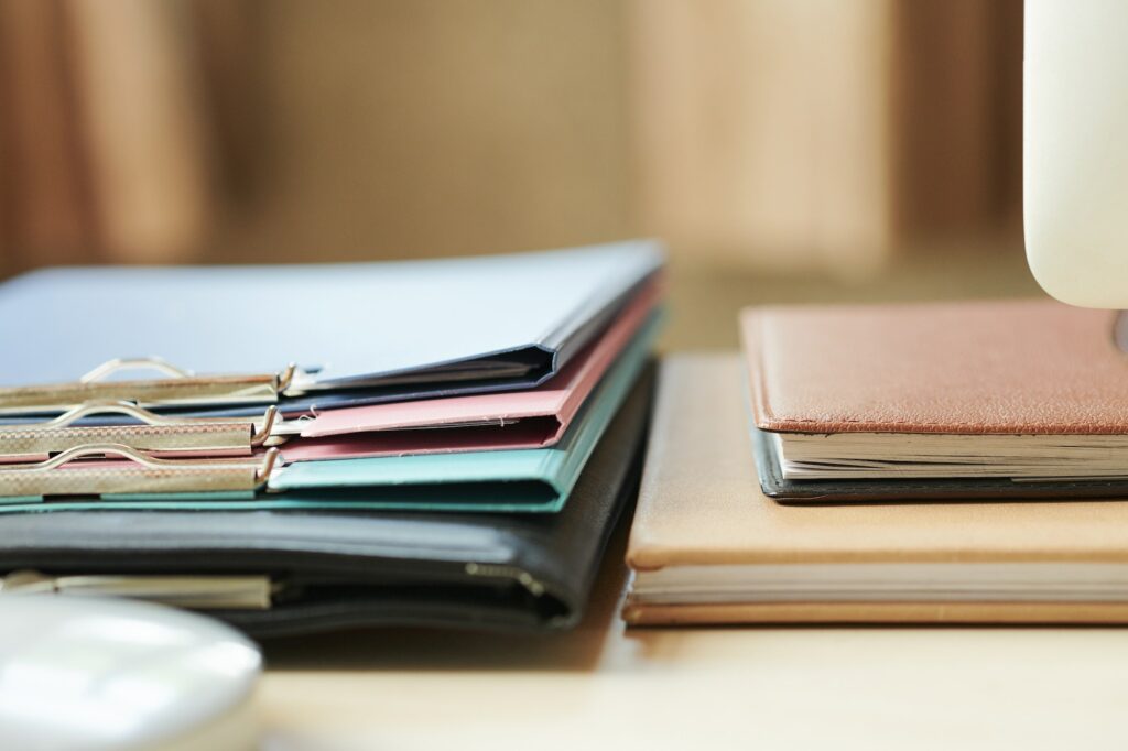 Folders and planners on office desk