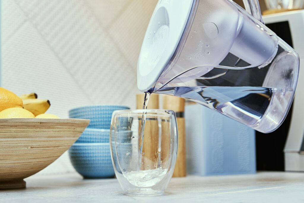 Pouring water from water filter